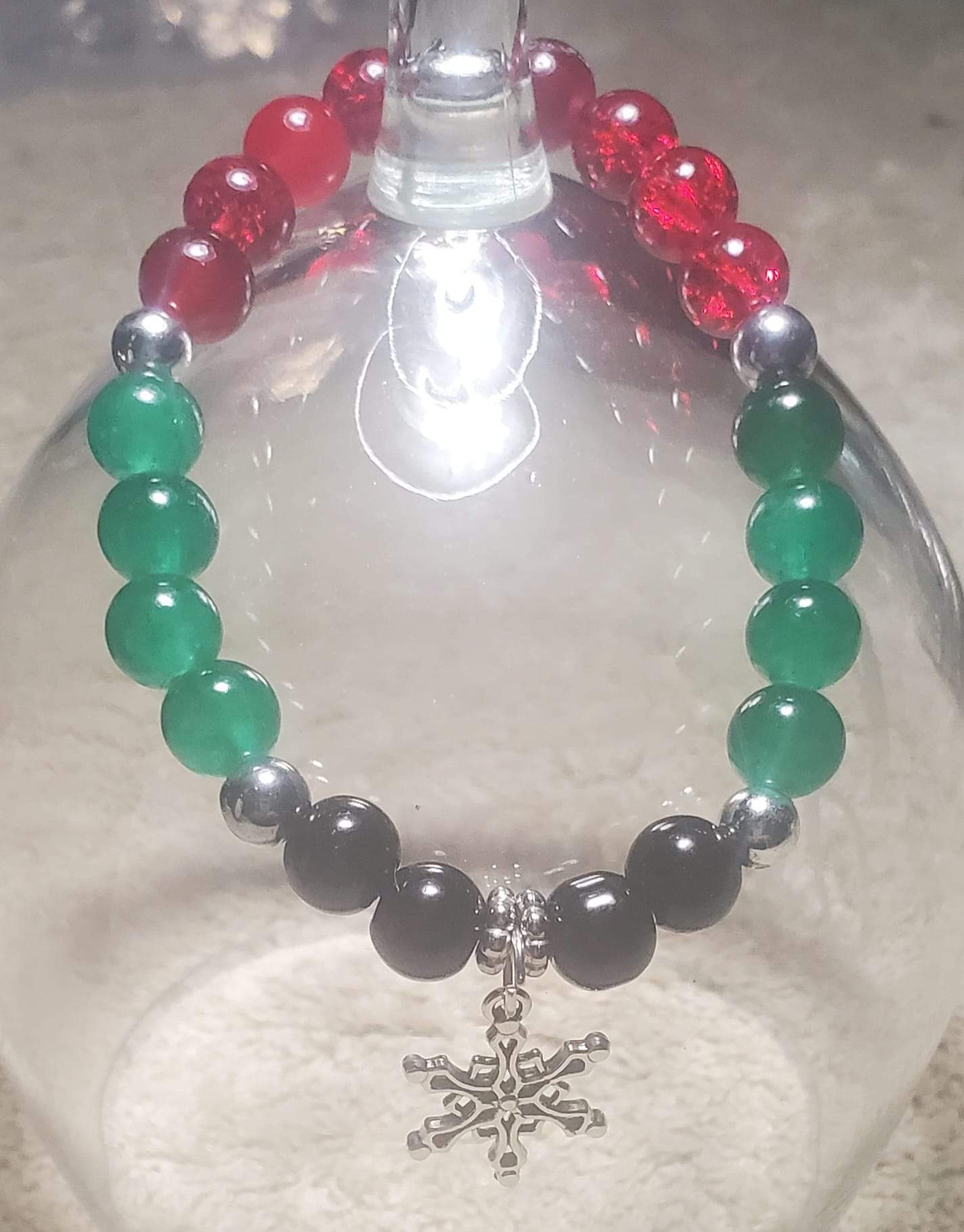 Quartz with red and green black onyx and silver balls with a silver snowflake with charm